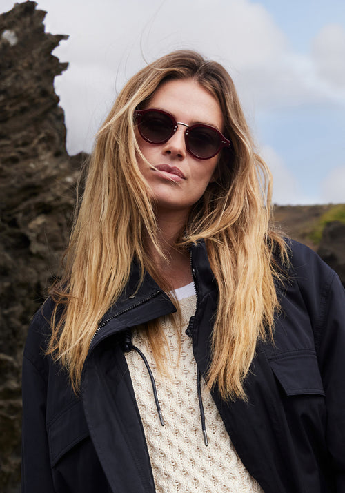 ASHTON | Brandy Silver Handcrafted, luxury burgundy acetate round KREWE sunglasses with silver stainless steel hardware womens model | Model: Frederique