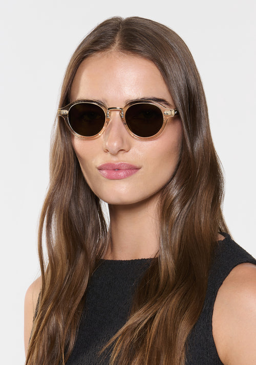 ASHTON | Haze + Iberia 12K Polarized Handcrafted polarized, luxury champagne pearlescent acetate round KREWE sunglasses with gold stainless steel metal hardware womens model | Model: Sam