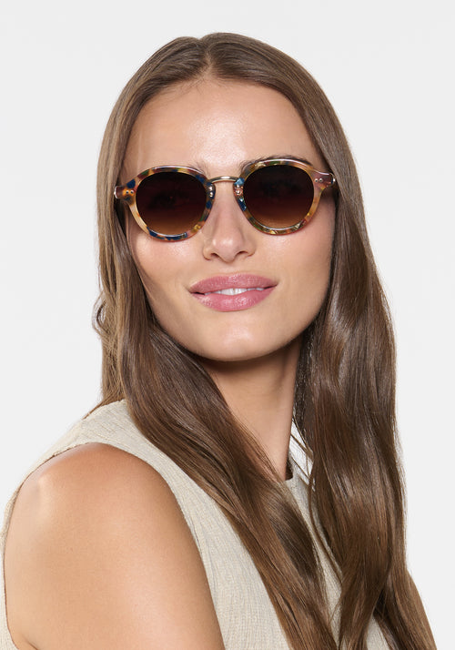 ASHTON | Tuscan Tortoise 12K Handcrafted, luxury multicolor tortoise acetate round KREWE sunglasses with stainless steel hardware womens model | Model: Sam