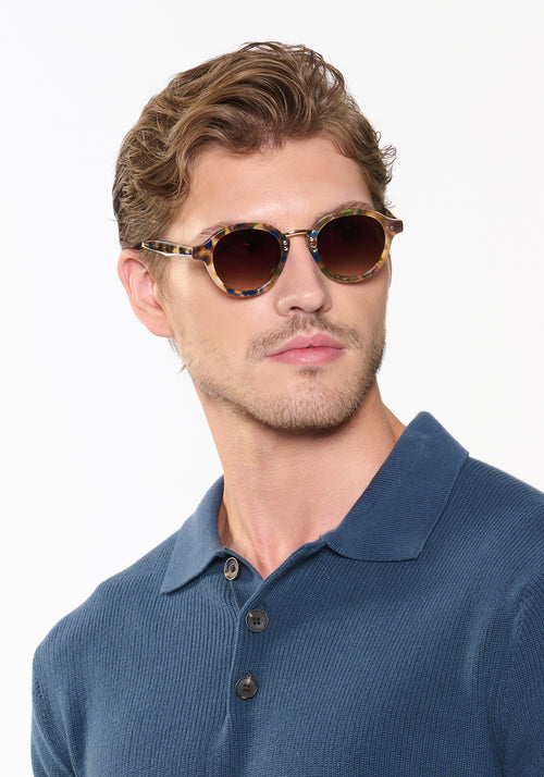 ASHTON | Tuscan Tortoise 12K Handcrafted, luxury multicolor tortoise acetate round KREWE sunglasses with stainless steel hardware mens model | Model: Linus