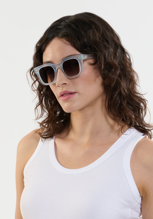 CELESTE | Handcrafted, luxury powder blue medium sized square cat eye KREWE sunglasses womens model | Model: Ione