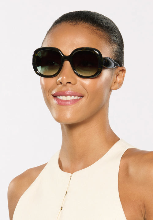 CHLOE | Tortuga Noir Handcrafted, luxury dark brown black tortoise acetate round oversized KREWE sunglasses womens model | Model: Sasha