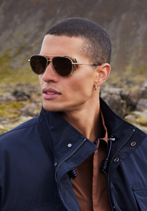 COLEMAN BLINKER | 18K Bottle Green + Zulu Handcrafted, luxury green and brown tortoise acetate large aviator KREWE sunglasses with blinkers mens model | Model: Vincent