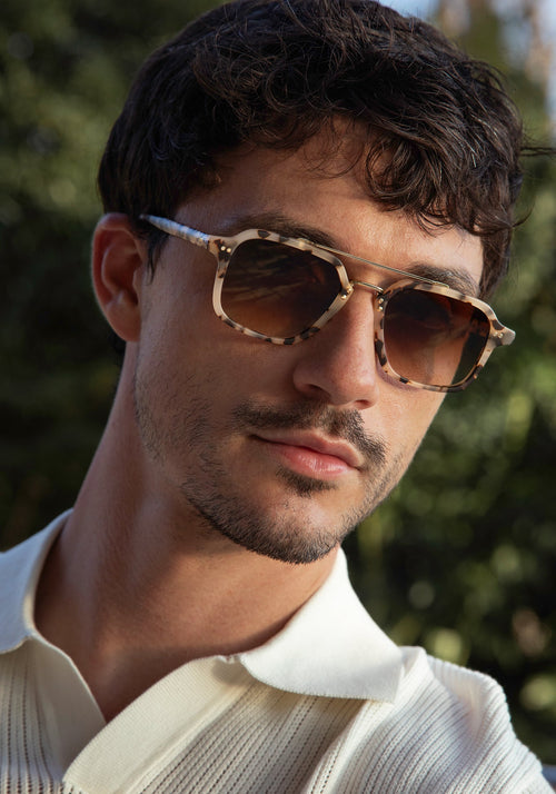COLTON | Matte Oyster 18K Handcrafted, luxury cream brown tortoise acetate and stainless steel square aviator KREWE sunglasses mens model | Model: Jacob