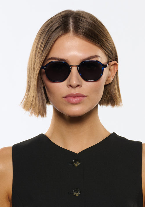 DAKOTA | Indigo Tortoise Silver Polarized Handcrafted, luxury, dark blue tortoise acetate polarized KREWE sunglasses with silver bridge and hardware women's model | Model: Michelle