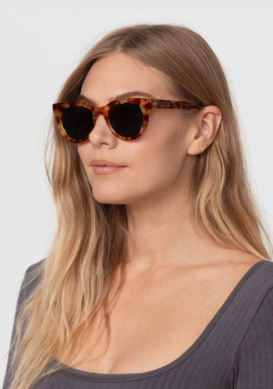 ELLIE | Hawksbill Handcrafted, luxury brown tortoise acetate round scalloped edge KREWE sunglasses womens model | Model: Maritza