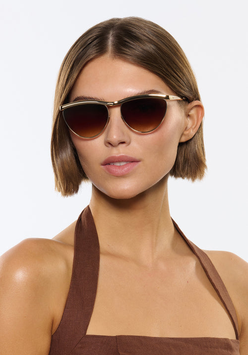 HEIDI | 12K Matte Black Fade Chroma + Blonde Venezia Handcrafted, luxury matte black fade chroma stainless steel large cat eye KREWE sunglasses womens model | Model: Michelle