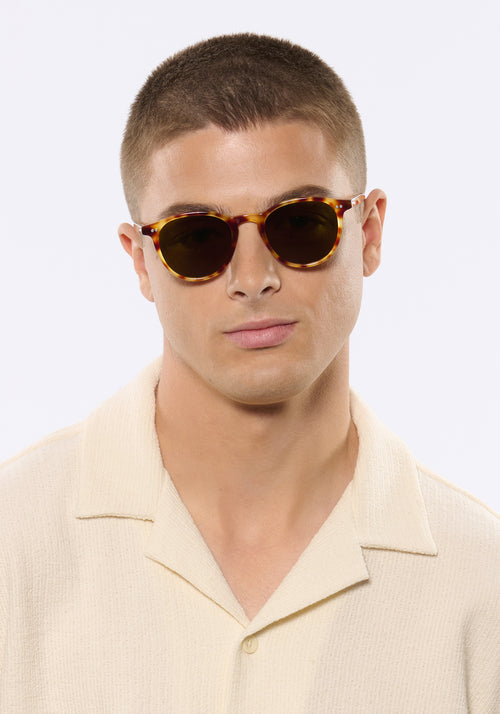 LANDRY | Hawksbill Handcrafted, luxury brown tortoise acetate round KREWE sunglasses mens model | Model: Joey