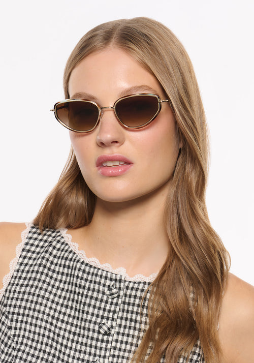 LEAH | 18K + Aquamarine Tortoise Handcrafted, luxury blue and brown tortoise acetate and stainless steel cat-eye KREWE sunglasses womens model | Model: Isa