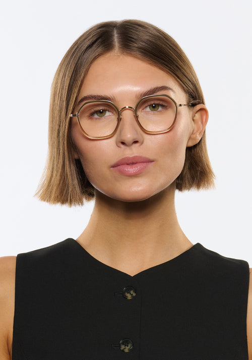 KREWE - LEIGHTON | 12K Titanium + Wasabi handcrafted, luxury green gradient octagonal eyeglasses with 12K gold plated metal hardware womens model campaign | Model: Michelle