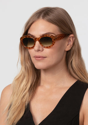MARGARET | Fernet Handcrafted, luxury brown checkered tortoise acetate medium sized oval bubble frame KREWE sunglasses womens model | Model: Maritza