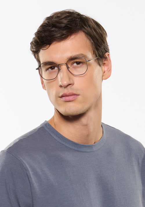 NELSON | Matte Raw Stainless Steel + Denim Handcrafted, luxury stainless steel oversized geometric round KREWE eyeglasses mens model | Model: Jegor