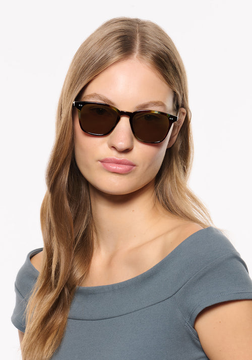 PIERCE | Blue Havana Handcrafted, luxury brown and blue tortoise acetate square KREWE sunglasses womens model | Model: Isa