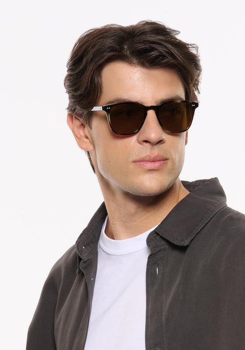 PIERCE | Blue Havana Handcrafted, luxury brown and blue tortoise acetate square KREWE sunglasses mens model | Model: Brent
