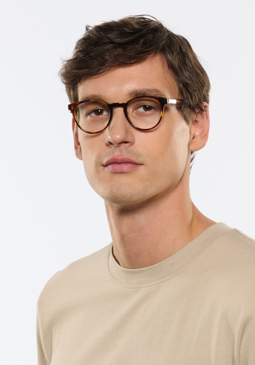 QUINN | Havana Handcrafted, luxury brown tortoise acetate round KREWE eyeglasses mens model | Model: Jegor