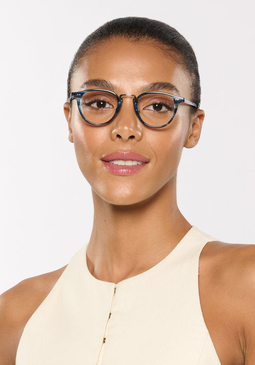 RILEY | Ripple Silver Handcrafted, luxury blue tortoise acetate round KREWE eyeglasses with silver stainless steel hardware womens model | Model: Sasha