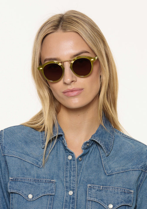 STL II | Cactus 18K Handcrafted, large round luxury lime green acetate and 18K gold metal bridge KREWE sunglasses womens model | Model: Isabelle