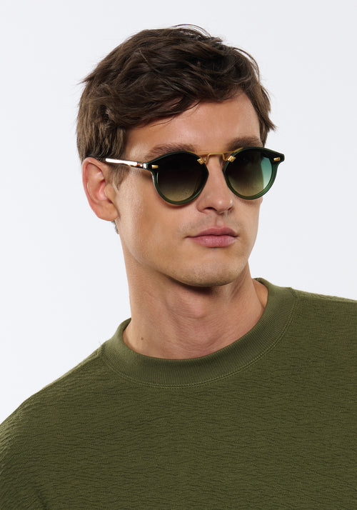 STL NYLON | Bottle Green + Zulu 18K Handcrafted, luxury dark green acetate round KREWE sunglasses with flat edge to edge nylon lens and 18k gold metal bridge mens model | Model: Jegor