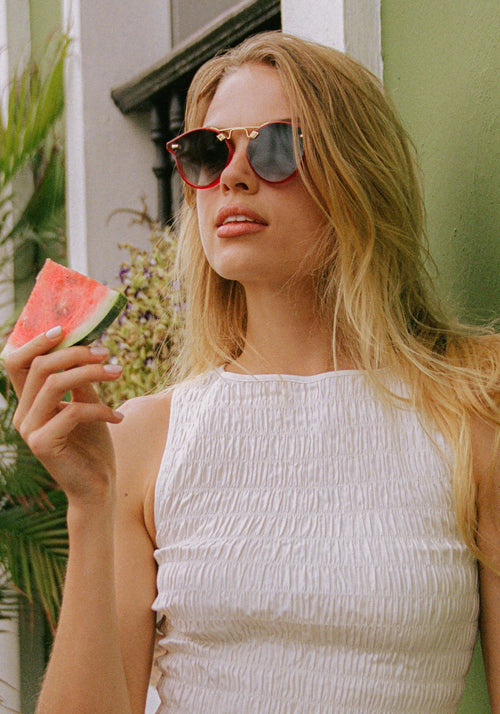 STL NYLON | Cherry 18K Handcrafted, luxury red cherry acetate round KREWE sunglasses with flat edge to edge nylon lens and 18k gold metal bridge womens model | Model: Chané