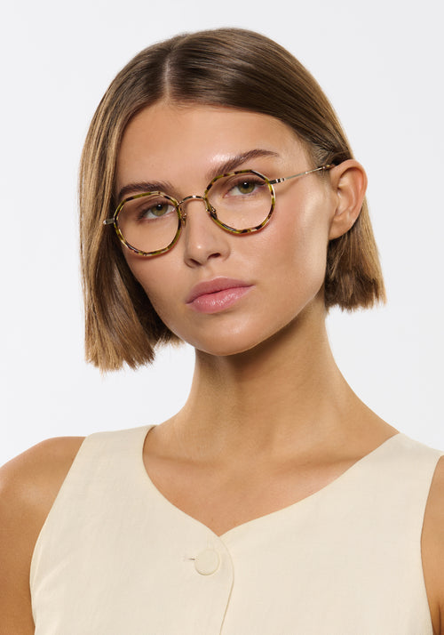 SIMON | 12K Titanium + Lynx Handcrafted neutral brown green round geometric titanium and acetate KREWE eyeglasses women's model | Model: Michelle