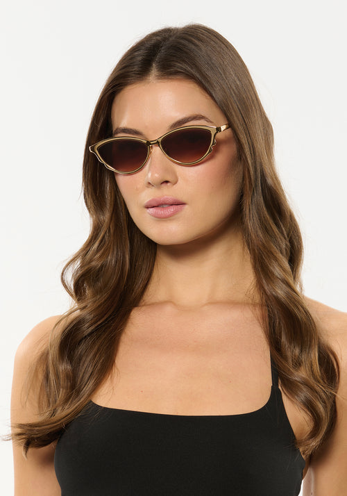 SOLANGE | 18K Chroma + Champagne Handcrafted, luxury gold chroma stainless steel large cat eye KREWE sunglasses womens model | Model: Kennidy