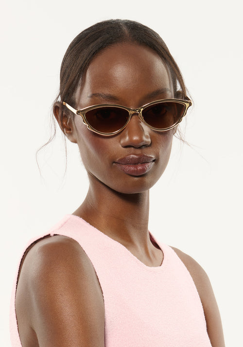 SOLANGE | 18K Chroma + Champagne Handcrafted, luxury gold chroma stainless steel large cat eye KREWE sunglasses womens model | Model: Brenda
