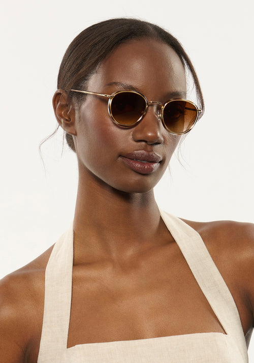 TATE | Aquamarine Tortoise 18K Handcrafted, luxury blue and brown tortoise acetate and stainless steel small round KREWE sunglasses womens model | Model: Brenda