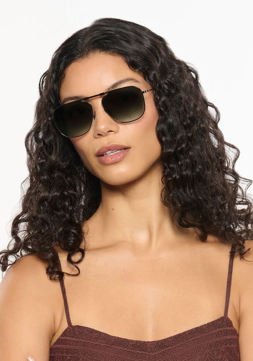 ZANDER FOLD | Gunmetal + Hemlock Tort Handcrafted, luxury stainless steel large folding square aviator KREWE sunglasses womens model | Model: Jessika