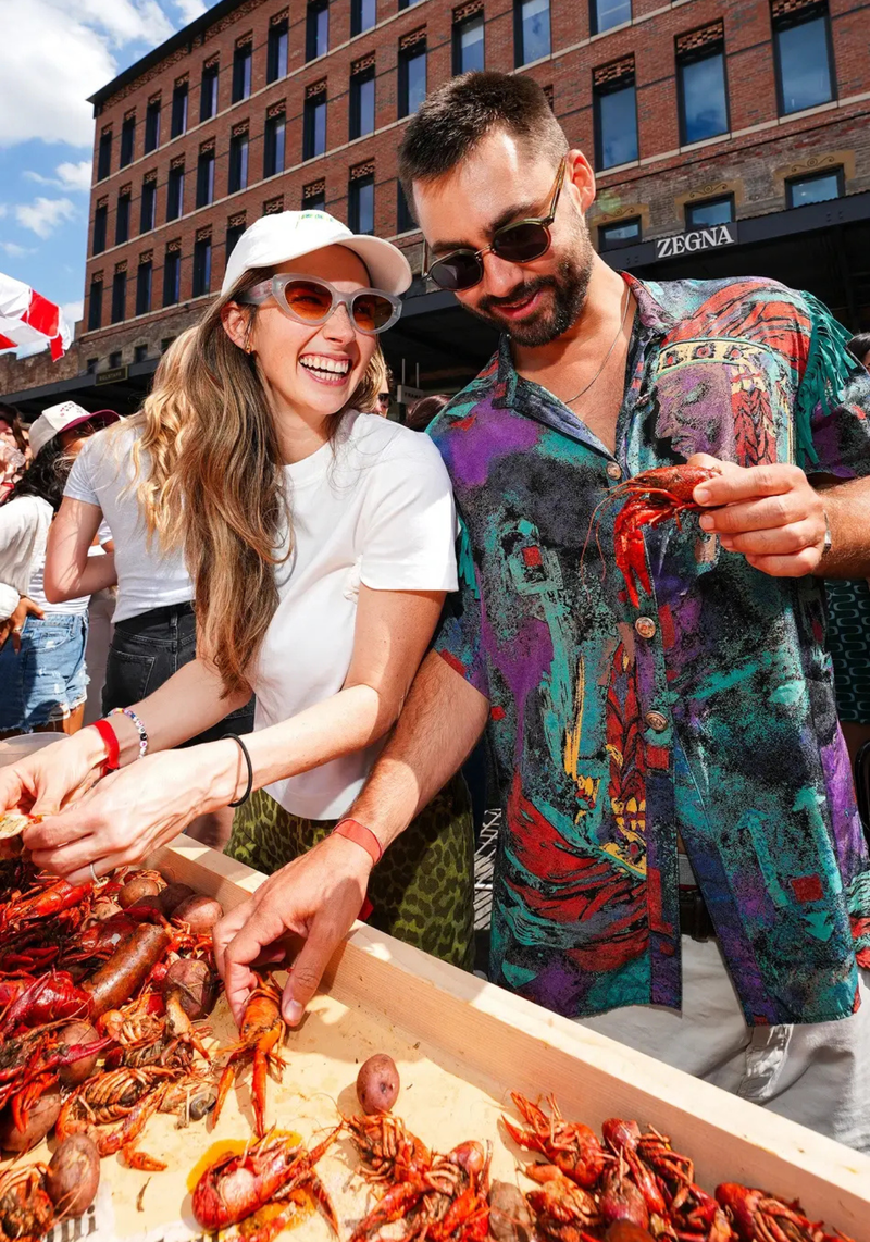 Attendees enjoying the KRAWFISH BOIL | womens model