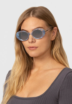 ALIXE | Opaline Mirrored Handcrafted, luxury blue and clear acetate KREWE sunglasses womens model | Model: Maritza