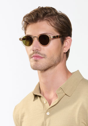 ASHTON | Haze + Iberia 12K Polarized Handcrafted polarized, luxury champagne pearlescent acetate round KREWE sunglasses with gold stainless steel metal hardware mens model | Model: Linus
