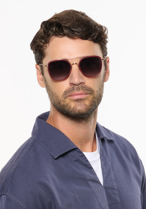 AUSTIN | 12K Titanium + Burgundy Leather Handcrafted, luxury burgundy leather and titanium aviator KREWE sunglasses mens model | Model: Ryan A.