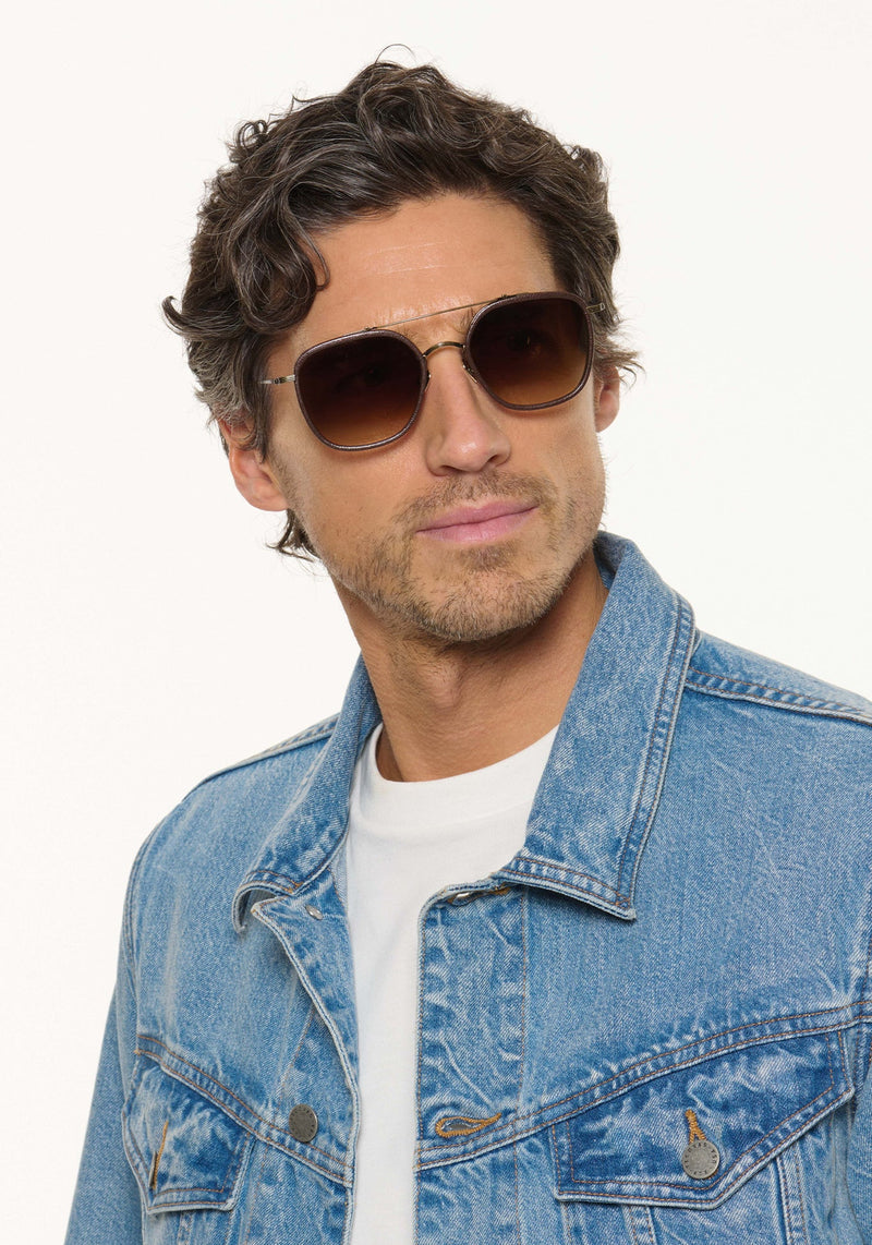 AUSTIN | Antique Gold Titanium + Brown Leather Handcrafted, luxury dark brown acetate and titanium aviator KREWE sunglasses mens model | Model: Ryan