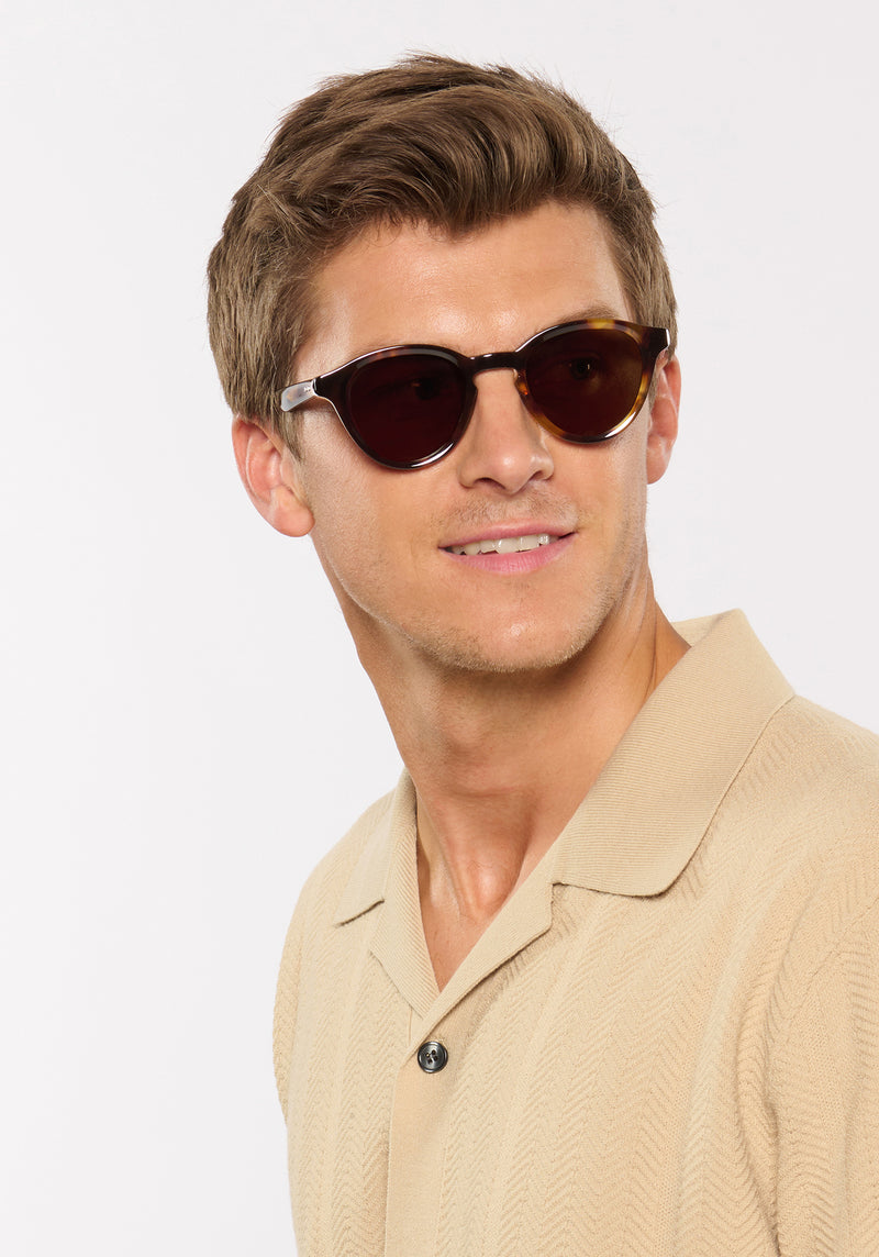 BARRETT | Havana Handcrafted, luxury brown tortoise acetate round KREWE sunglasses mens model | Model: Ben