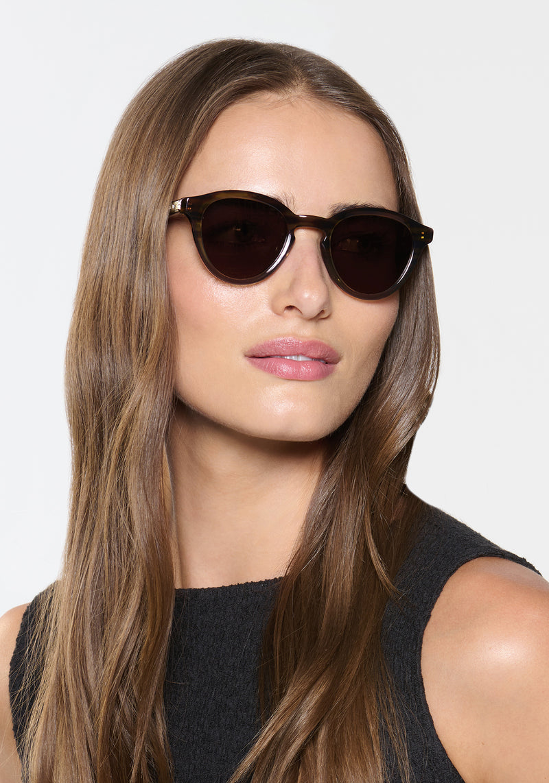 BARRETT | Marsh Polarized Handcrafted, luxury brown and green gradient acetate round KREWE polarized sunglasses womens model | Model: Sam