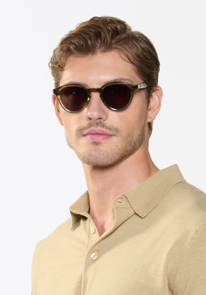BARRETT | Marsh Polarized Handcrafted, luxury brown and green gradient acetate round KREWE polarized sunglasses mens model | Model: Linus