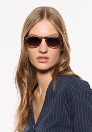 BILLIE | Blush Tortoise Handcrafted, luxury brown and pink tortoise acetate round aviator KREWE sunglasses womens model | Model: Isa