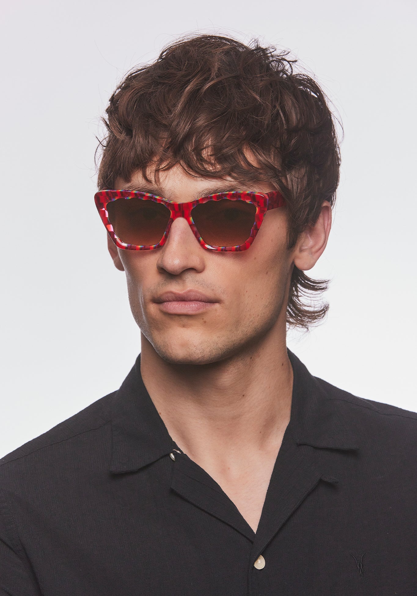 BRIGITTE | Cherry over Fierte Handcrafted, luxury red and rainbow checkered scalloped cat-eye KREWE sunglasses mens model | Model: Cameron