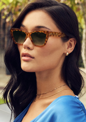 BRIGITTE | Fernet Handcrafted, luxury brown tortoise scalloped cat-eye KREWE sunglasses womens model campaign | Model: Dunya