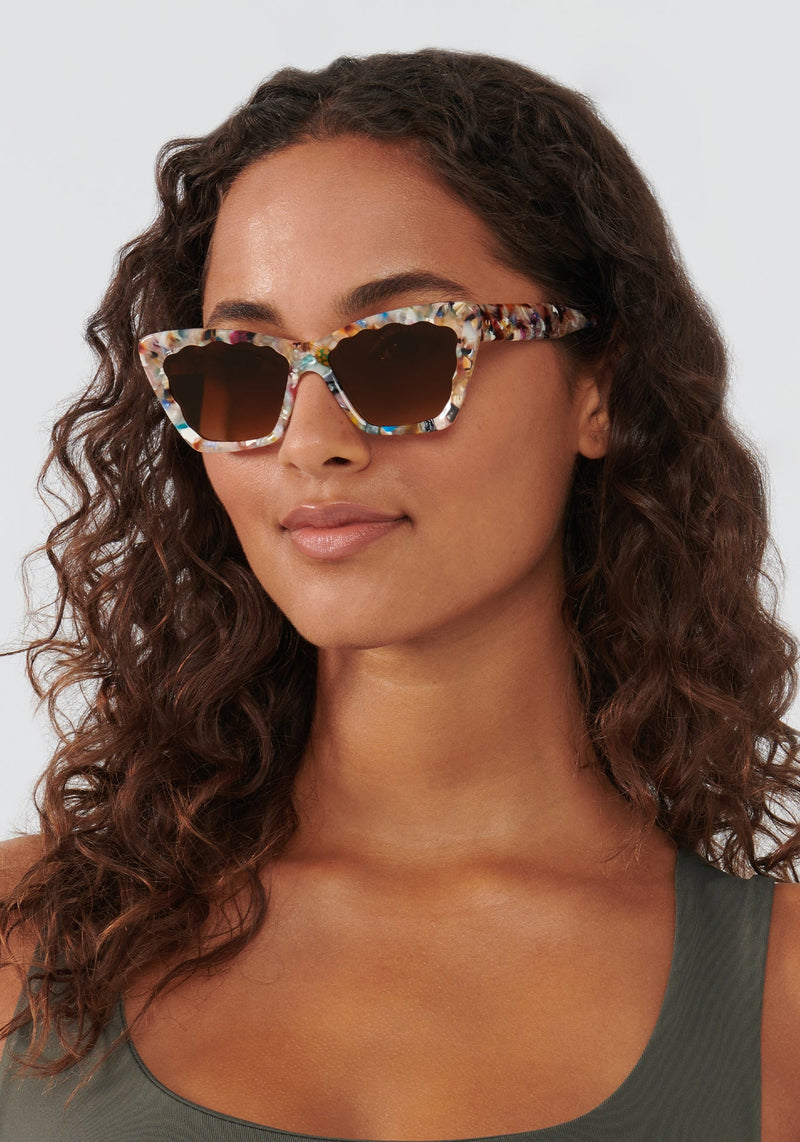 KREWE - BRIGITTE | Gelato handcrafted, luxury colorful tortoise scalloped cat eye sunglasses womens model | Model: Meli