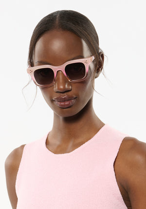 CELESTE | Sparkling Rosé Handcrafted, luxury light pink acetate medium sized square KREWE sunglasses womens model | Model: Brenda