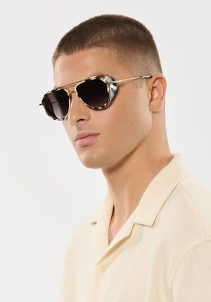 COLEMAN BLINKER | Bone 12K Handcrafted, luxury white and grey tortoise acetate large aviator KREWE sunglasses with blinkers mens model | Model: Joey