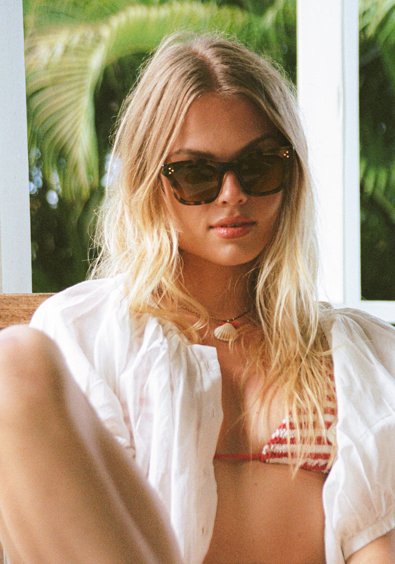 CELESTE | Handcrafted, luxury tortoise acetate medium sized square cat eye KREWE sunglasses womens model | Model: Chane