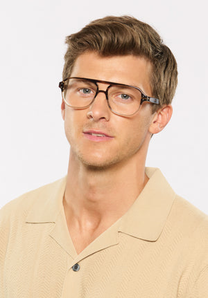 CHARLIE | Walnut Handcrafted, luxury brown acetate oversized aviator KREWE eyeglasses mens model campaign | Model: Ben