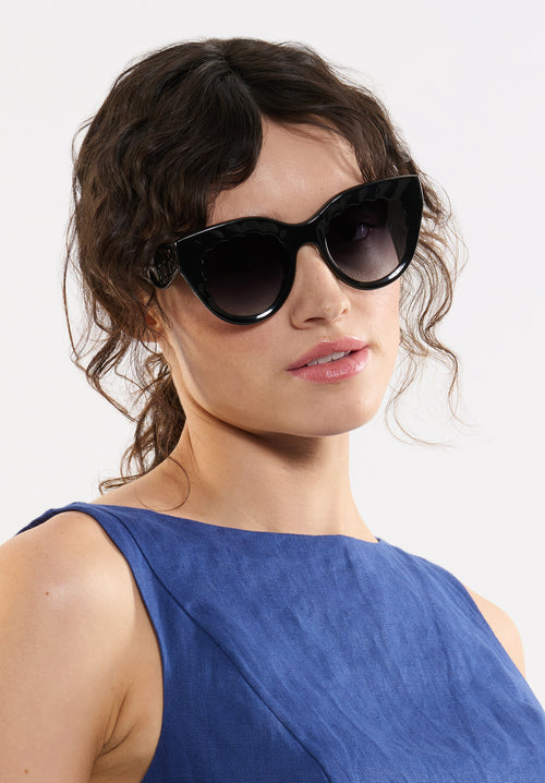 CHARLOTTE | Black + Black and Crystal Handcrafted, luxury glossy black acetate oversized scalloped cat-eye KREWE sunglasses womens model campaign | Model: Ione
