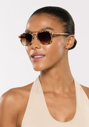 COLTON | Matte Oyster 18K Handcrafted, luxury cream brown tortoise acetate and stainless steel square aviator KREWE sunglasses womens model | Model: Sasha