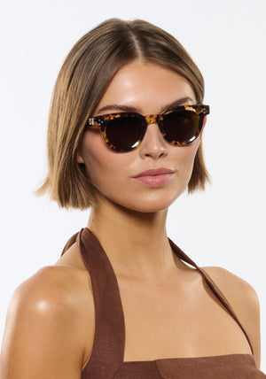 DEVON | Nikko Tortoise Handcrafted, luxury brown tortoise acetate round classic KREWE sunglasses womens model | Model: Michelle