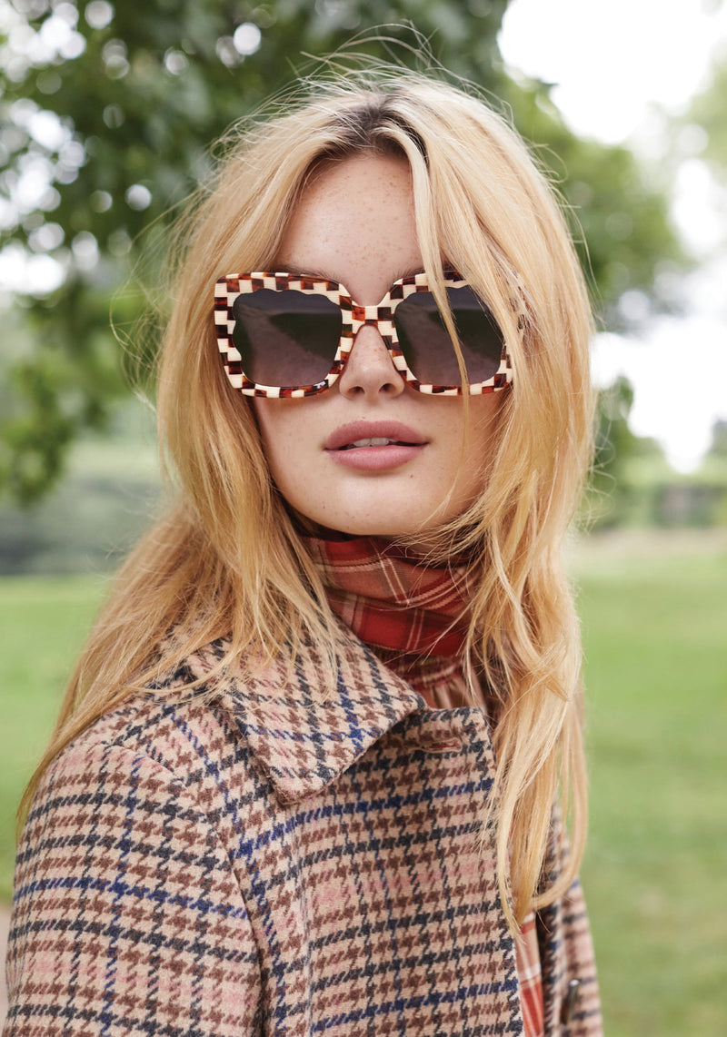 KREWE SUNGLASSES - ELIZABETH | Caffe handcraafted, luxury brown and white checkered acetate scalloped sunglasses womens model campaign | Model: Fletcher