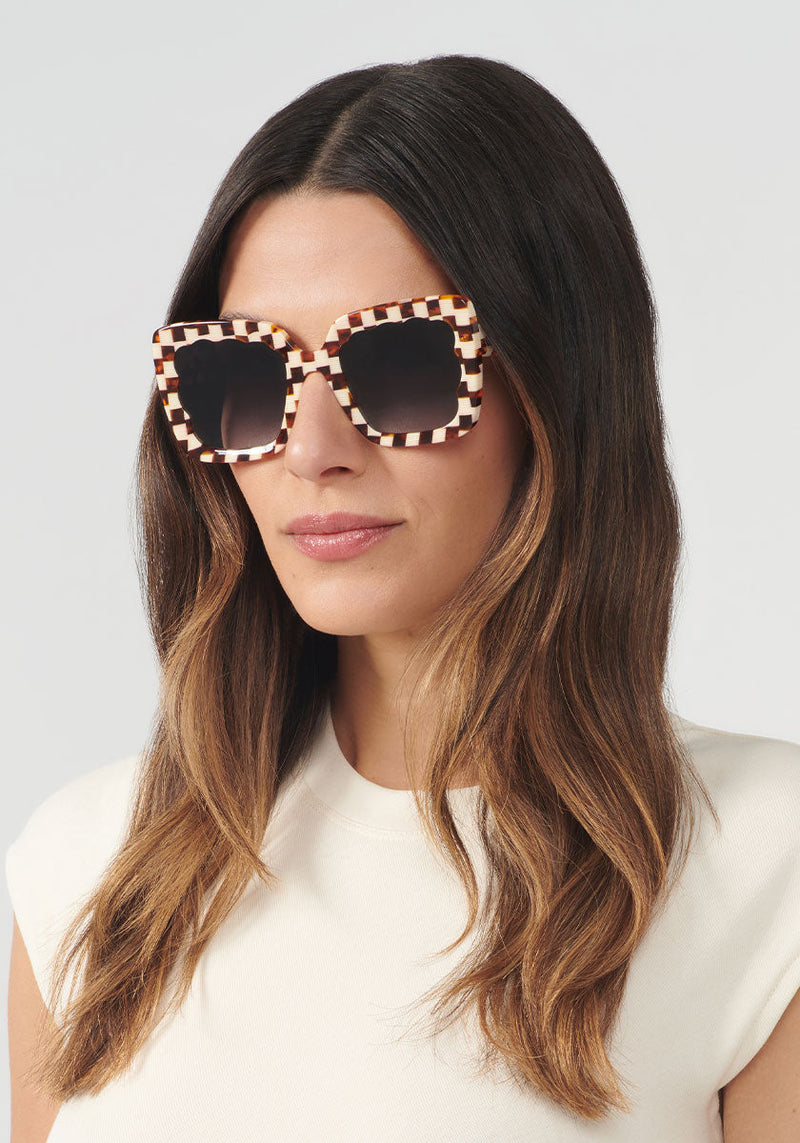 KREWE SUNGLASSES - ELIZABETH | Caffe handcraafted, luxury brown and white checkered acetate scalloped sunglasses womens model | Model: Olga