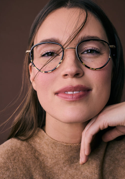 EMERSON | 18K Titanium + Black to Zulu Handcrafted, luxury black to tortoise acetate and metal teardrop aviator KREWE eyeglasses womens model campaign | Model: Eliza